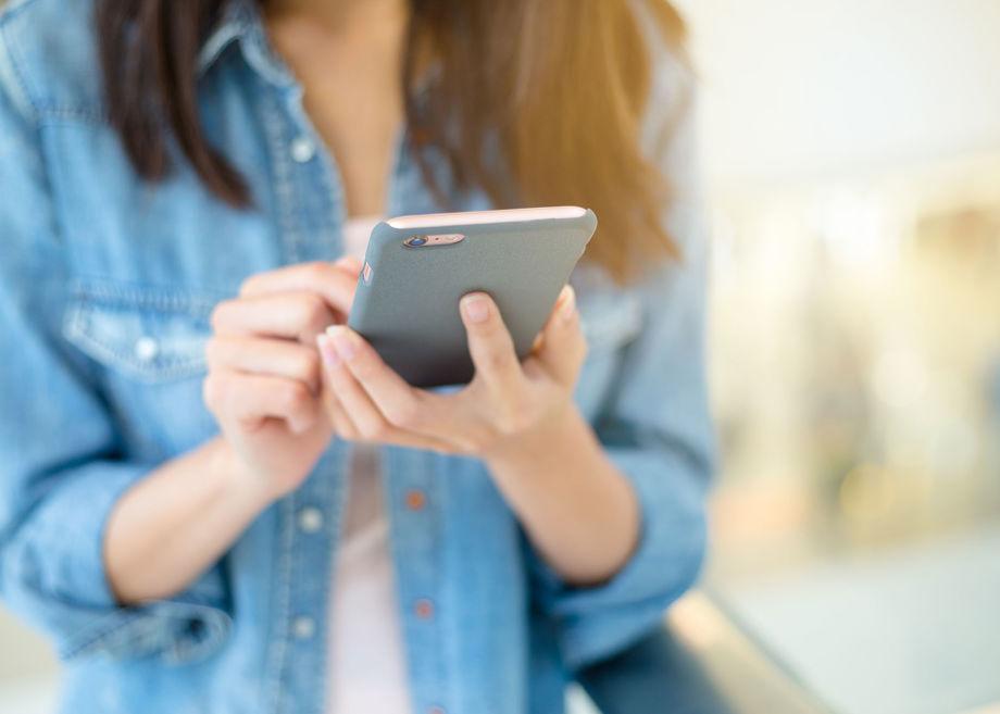 Person using handheld technology