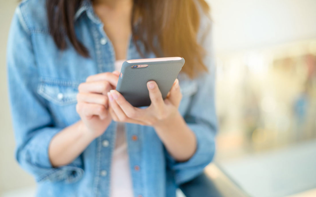 Person using handheld technology