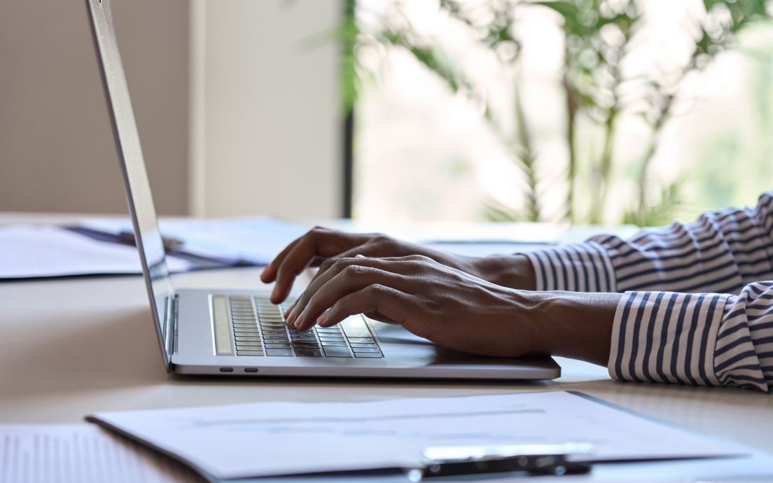 Person typing on a laptop